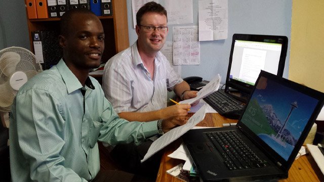 international volunteering Irish volunteer working alongside local worker in Africa