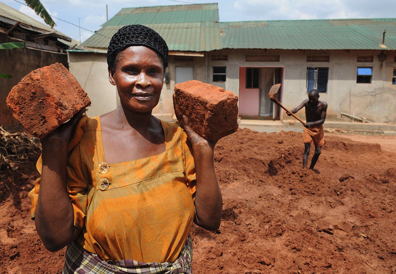 Miss Immaculate poses with some bricks from her factory