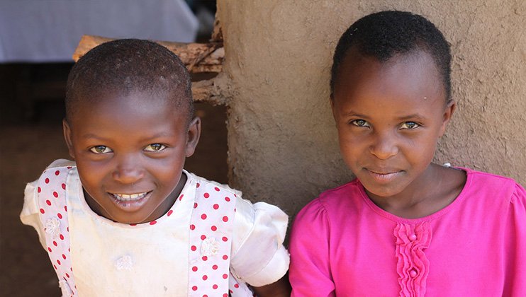 Two young girls smiling